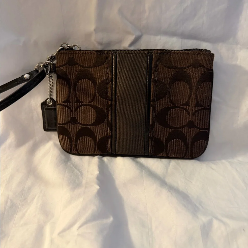Coach Signature C canvas wristlet.